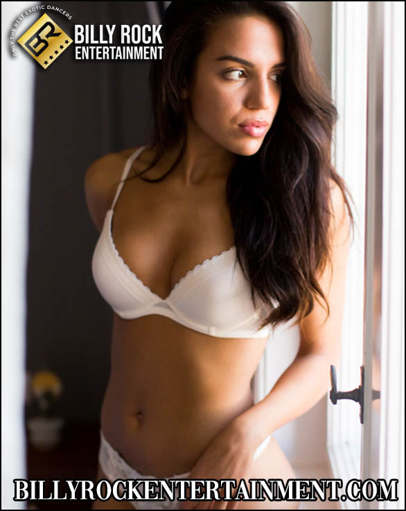 Marina gazing out the window in white lingerie.
