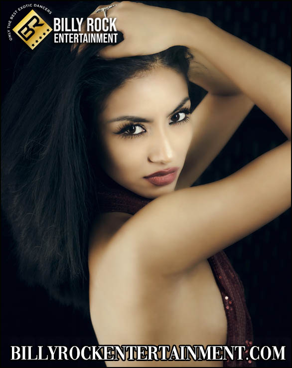 Maya Jade with an intense gaze, black hair, and a striking pose.