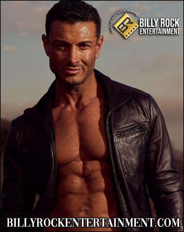 Antonio, exotic dancer in open leather jacket, clear sky background.