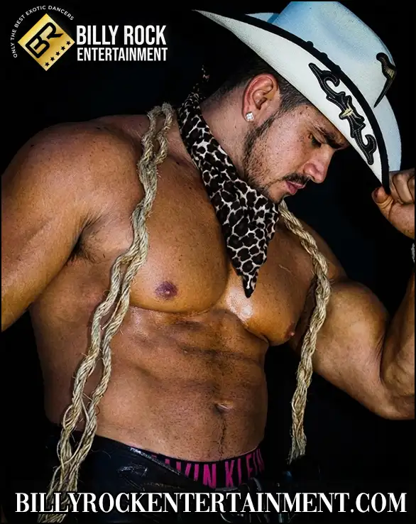 Male dancer tipping a white cowboy hat with bandana.