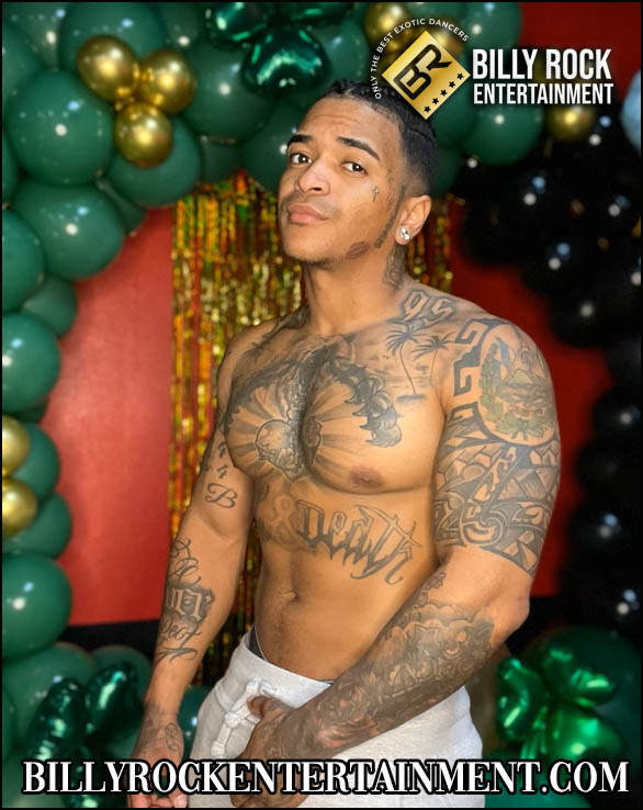 Lover Boy: Shirtless male dancer with tattoos, crown on shoulder, red curtain background.