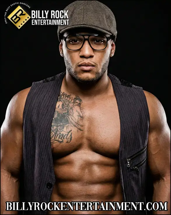 Shirt opened, abs showing, Rico Love has his glasses on and looks with appeal