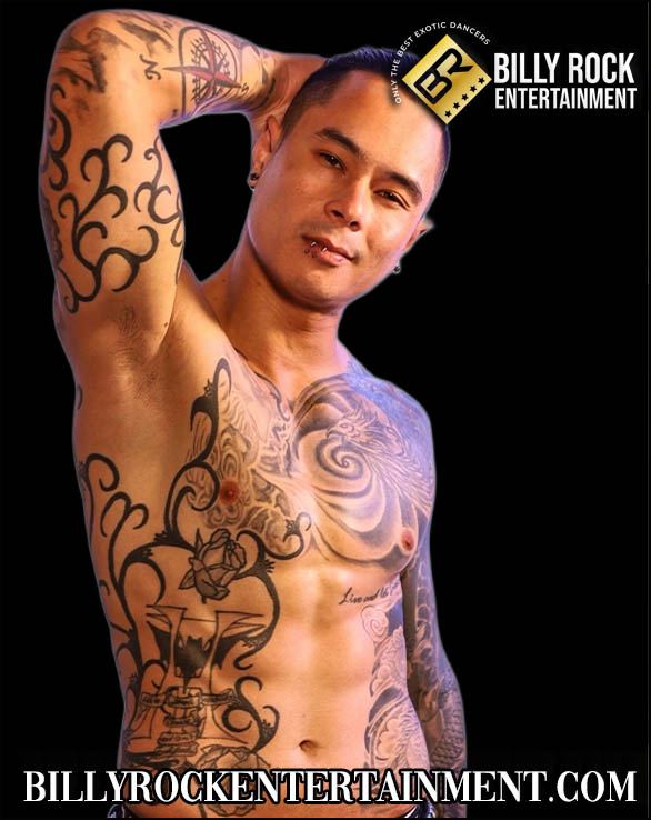 Venom shirtless with extensive tattoos and a pierced lower lip, looking confidently at the camera.