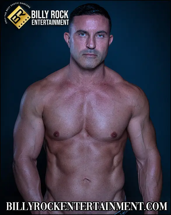 Male stripper looks at the camera seductively